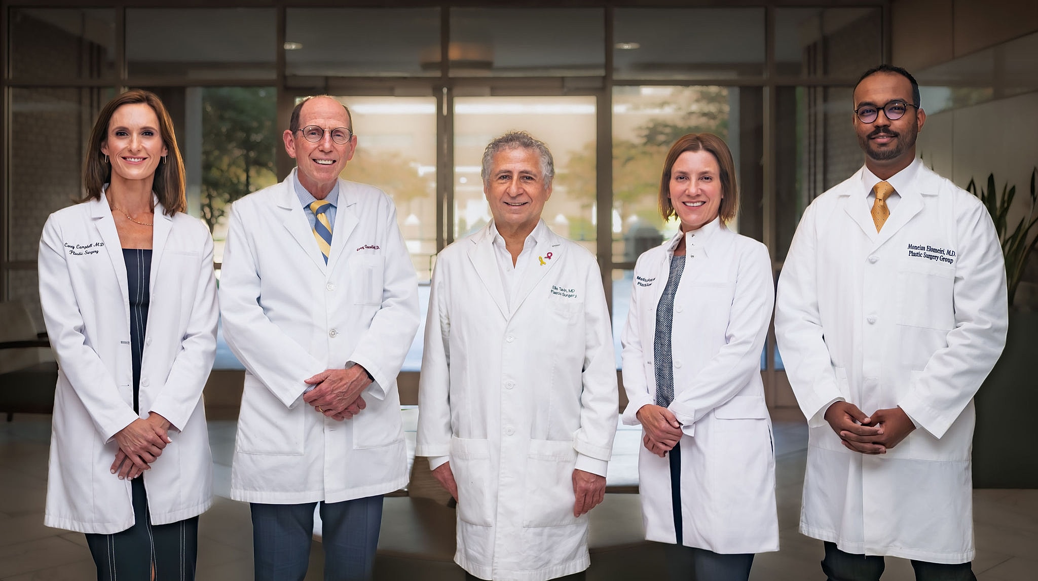 Group of medical professionals in white lab coats.
