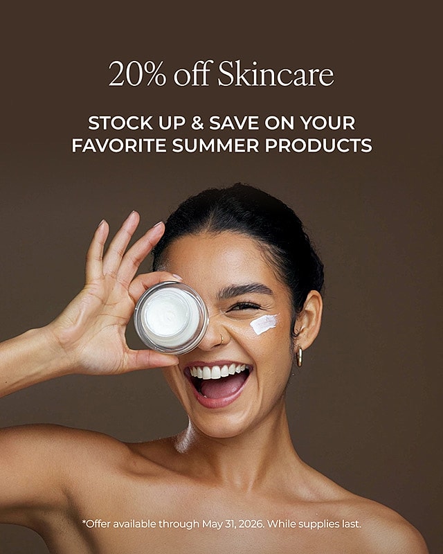 Woman smiling with skincare product, 20% off.