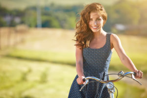 Young woman with bicycle