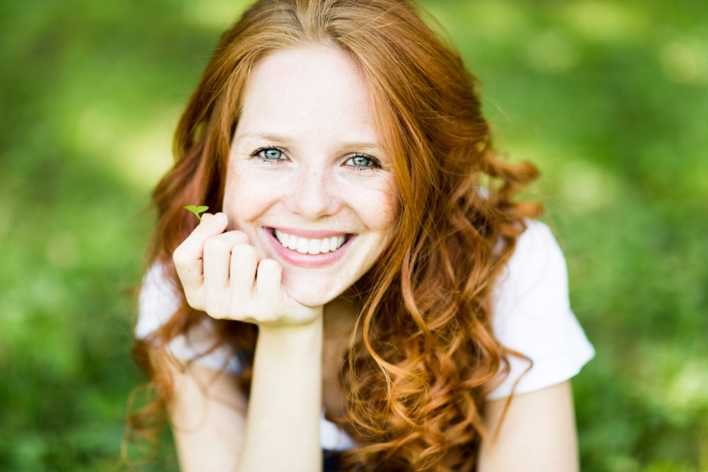 Woman smiling in grass